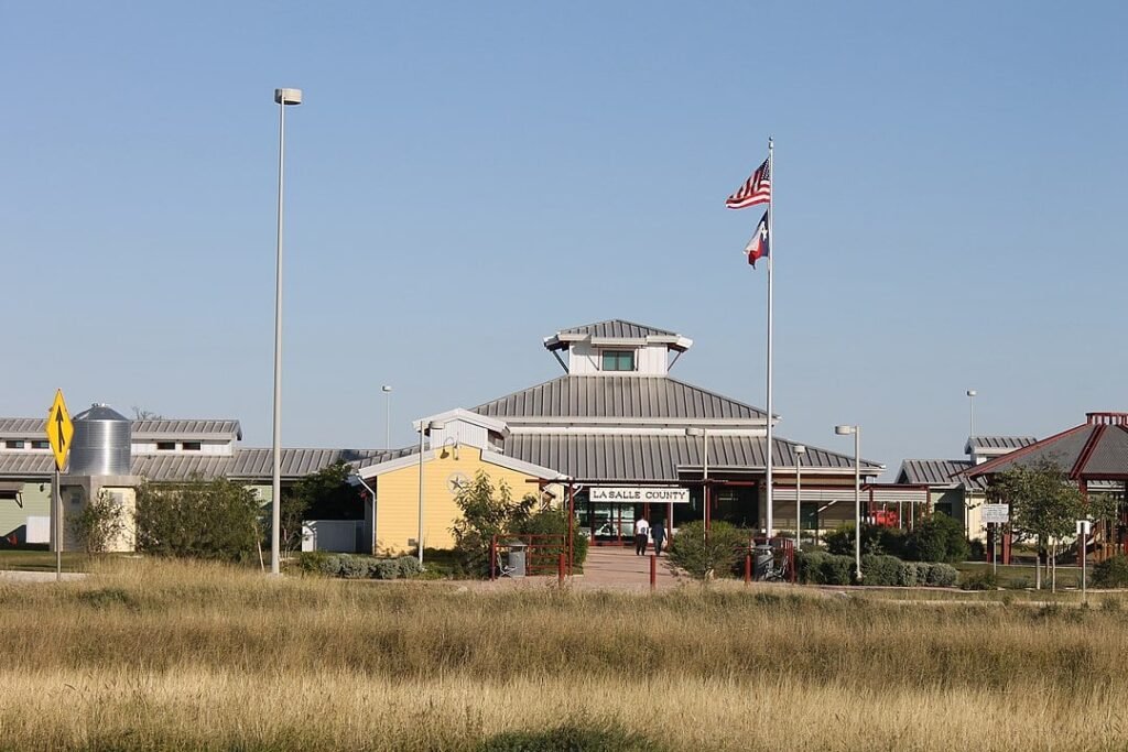 LaSalle County Visitor Center in Cotulla, Texas, featuring a modern architectural design with flagpoles.